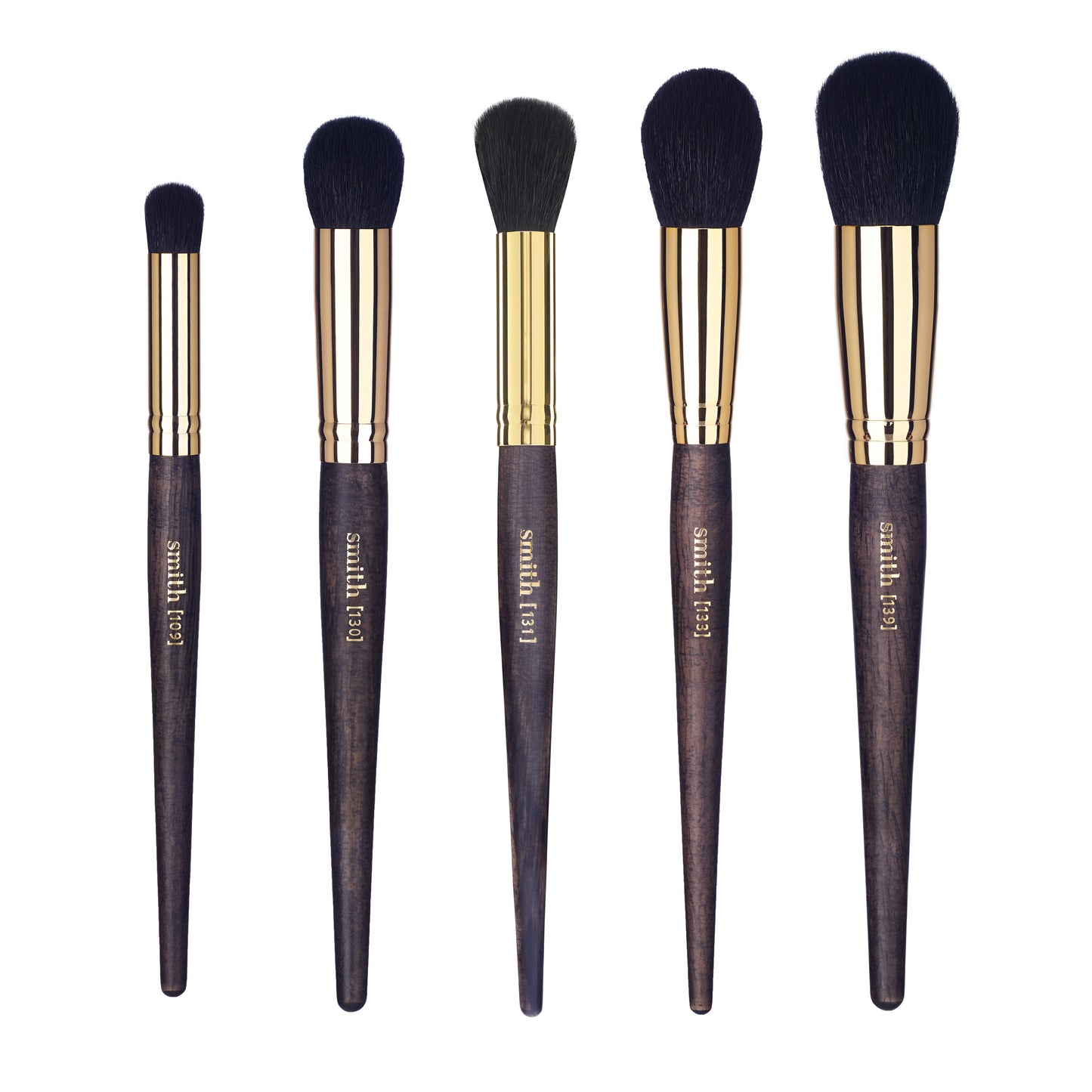 A set of five different shaped and sized buffing brushes with dark handles and gold ferrules, labeled with numbers and brand name 'Smith'.